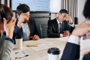 Managers of company financial department meeting to discuss crisis.