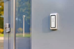 RFID reader at office entrance for access by RFID key card, lock and key control system. RFID door lock security identification system. Employees only access