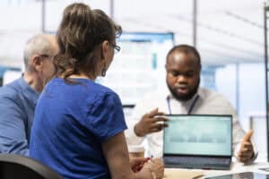 Senior IT professional discussing IT training with clients