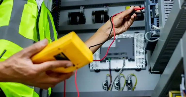 Technician checks electrical project subject to California prevailing wage law
