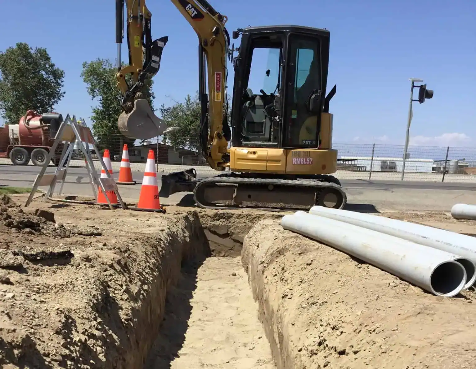 Sebastian crew installing underground conduit for the Fresno State communications loop.